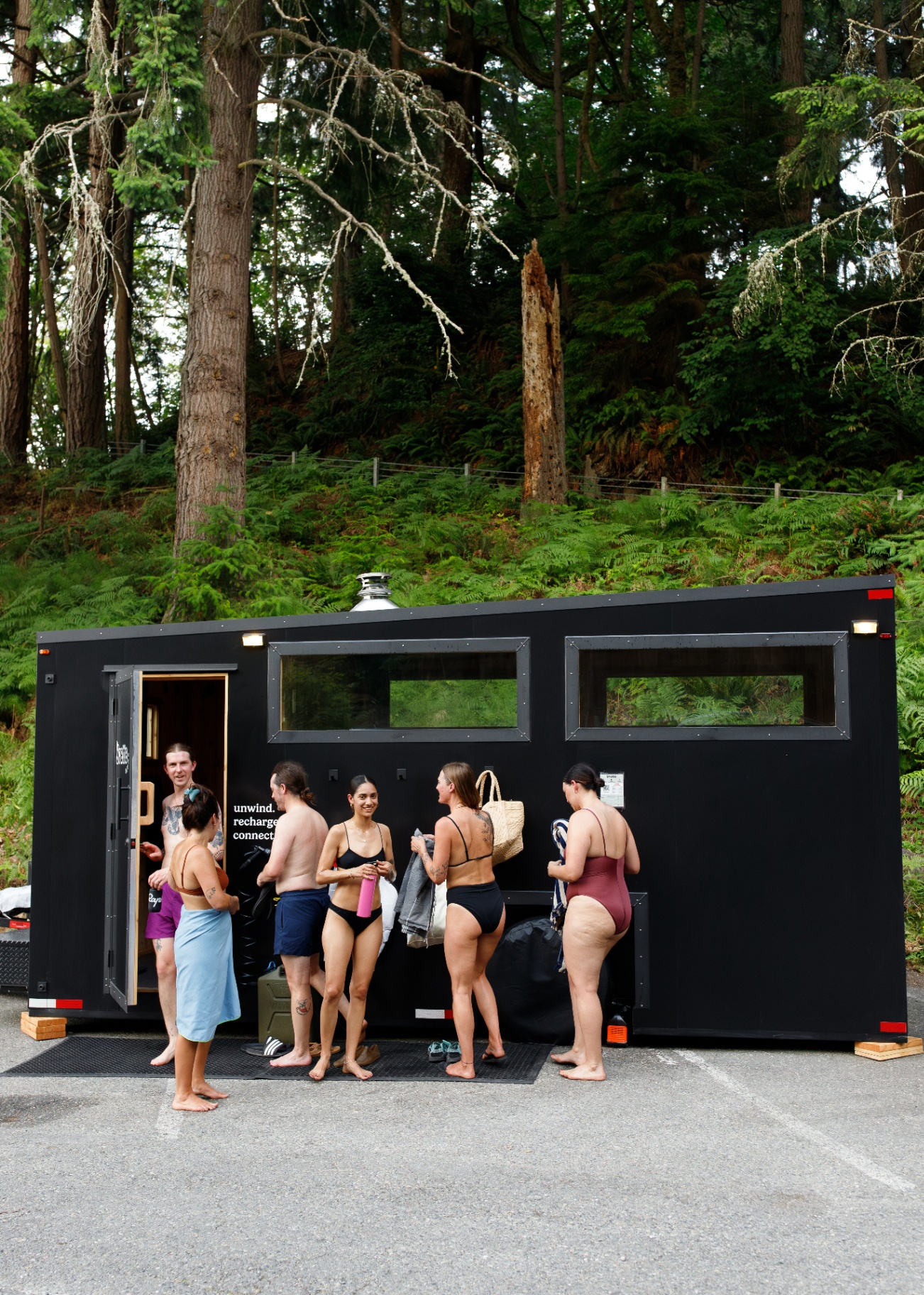 Guests outside the Svette sauna trailer