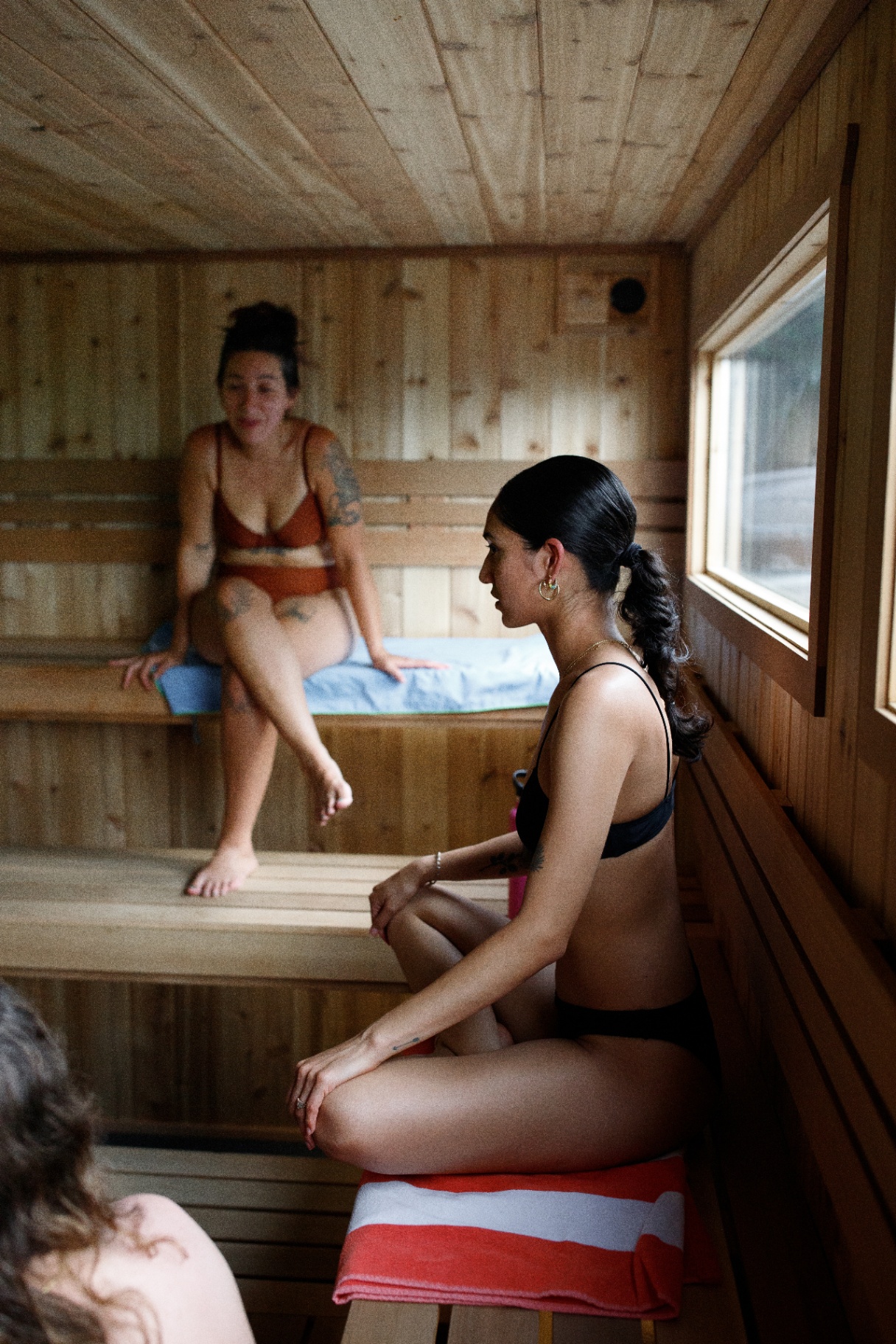 Guests relaxing inside the cedar sauna